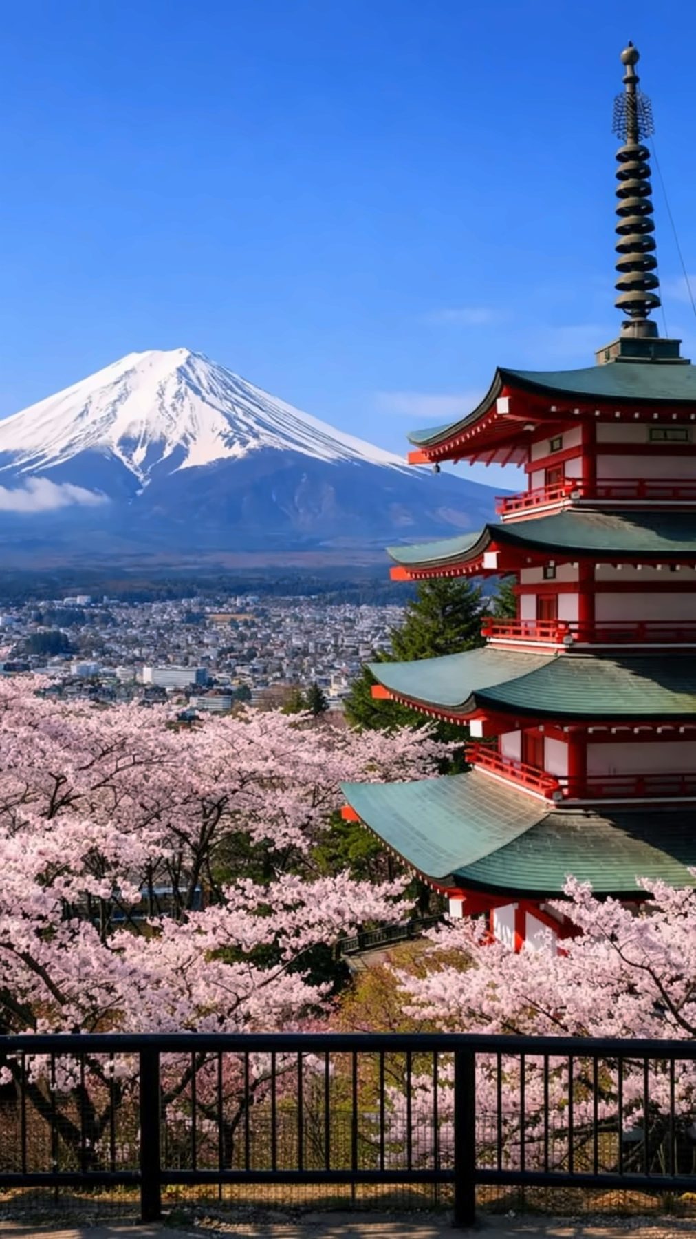 Le mont Fuji, une pagode rouge et des cerisiers en fleurs